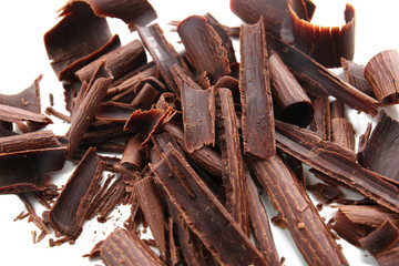 Chocolate curls on white background, closeup