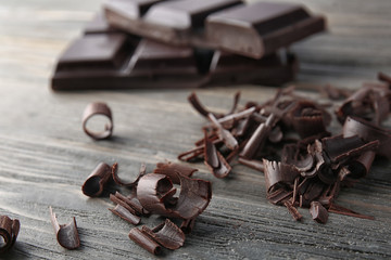 Chocolate curls on wooden table