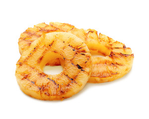 Grilled pineapple slices on white background