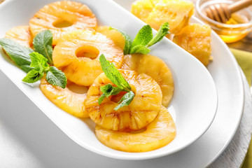 Grilled pineapple slices on plate, closeup