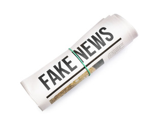 Rolled newspaper on white background