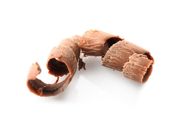 Delicious chocolate curls on white background