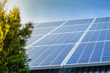 Naklejka premium solar panels on the roof of a private home