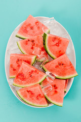 Fresh watermelon slices on ice cubes