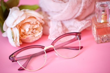 pink glasses on pink background