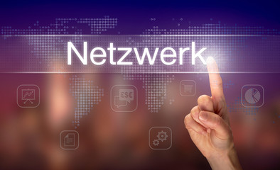 A businessman pressing a Network "Netzwerk" button in German on a futuristic computer  display