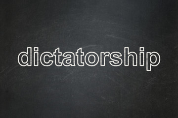 Obraz premium Political concept: text Dictatorship on Black chalkboard background