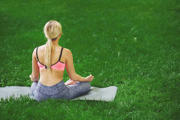 Young woman outdoors, relax meditation pose