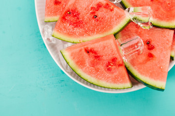 Fresh watermelon slices on ice cubes