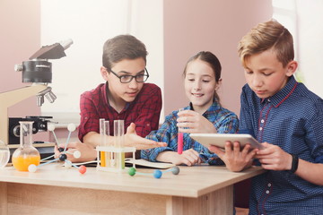 Pupils doing biochemistry research, stem education
