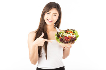 Beautiful Attractive Asian woman smile with white teeth holding fresh salad vegetable in hand feeling so happiness and cheerful whit Healthy Skin,Isolated on white background,Healthcare concept