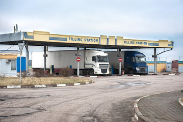 Fototapeta na wymiar Trucks in filling station