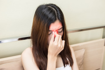 Asian young Woman have a Migraine after wake up in the morning,Healthcare Concept