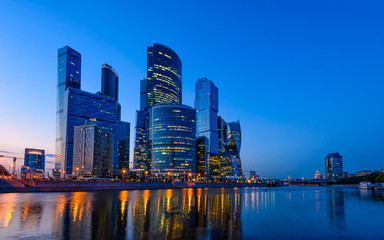 Fototapeta na wymiar Skyscrapers of Moscow City business center and Moscow river in Moscow at night, Russia