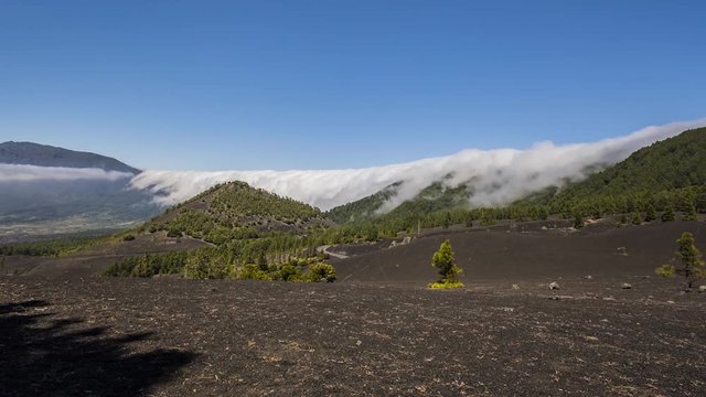 Timelapse of clouds rolling over volcanic landscape in La Palma, Canary Islands, Spain