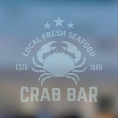 Obraz premium Seafood vector emblem with crab on blured backdrop