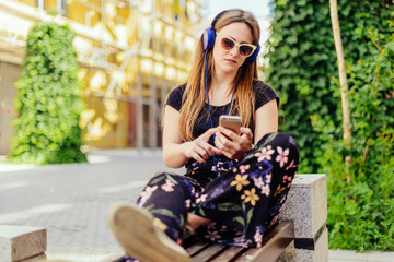 CLOSEUP PORTRAIT OF YOUNG GIRL LISTENING TO MUSIC