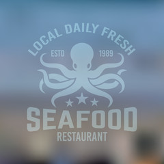 Seafood emblem with octopus on blured background