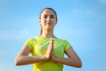 Young girl doing yoga outdoor