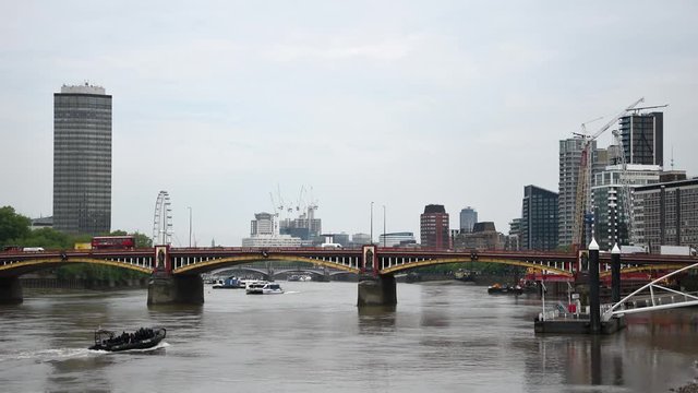 Thames River near Vauxhall Bridge in London and police boat