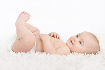 Cute  baby girl  on white  blanket 