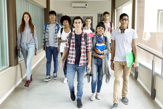Students walking in school corridor