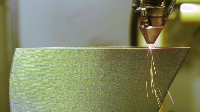 3D metal printer produces a steel part.