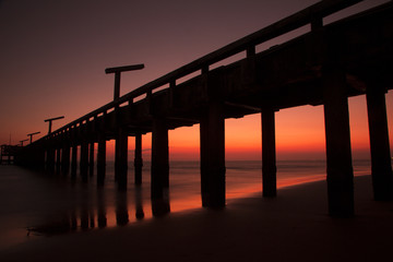 Fototapeta premium Bridge in sunset at Mae Ramphueng Beach,Rayong Province,Thailand