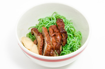 Green noodles with duck in bowl.