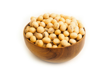 Soybeans on wooden bowl on white background