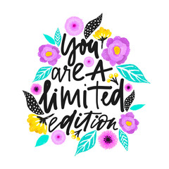 Yuo are a limited edition. Handdrawn illustration. Positive quote made in vector.Motivational slogan. Inscription for t shirts, posters, cards. Floral digital sketch style design. Flowers around.
