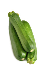 three ripe gardening green oblong zucchini