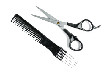 Black hair scissors and comb isolated on white background.