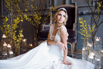 Blonde bride in fashion white wedding dress with makeup