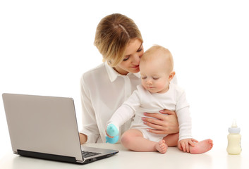 Portrait of a mother and a child working at a computer.