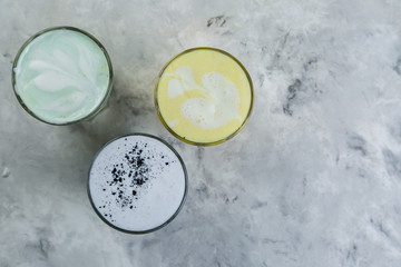 Selection of colorful super lattes on marble background