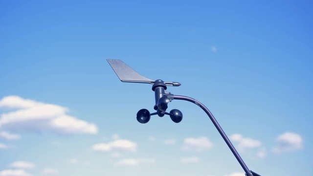 Propeller of a solar module's wind turbine is revolving from the wind
