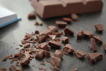 Delicious chocolate shavings on table, closeup