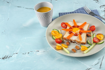 Creative breakfast for children on plate. Recipe ideas with bread