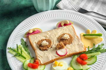 Creative breakfast for children on plate. Recipe ideas with bread