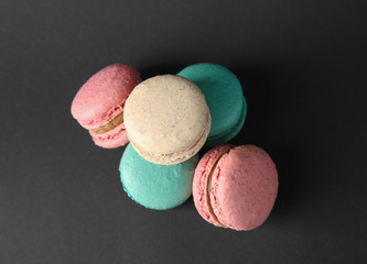 Delicious macarons on dark background