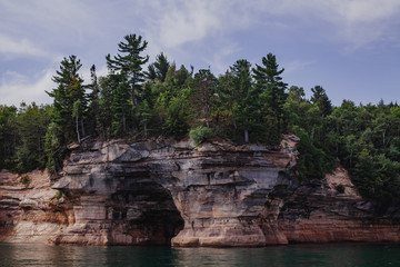 Fototapeta na wymiar Pictured rocks national park on the Lake Superior, USA. Colorful textured rocks background
