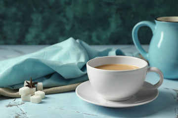 Cup of hot masala tea on light table