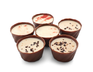 Tasty chocolate candies on white background