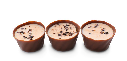 Tasty chocolate candies on white background