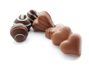 Tasty chocolate candies on white background