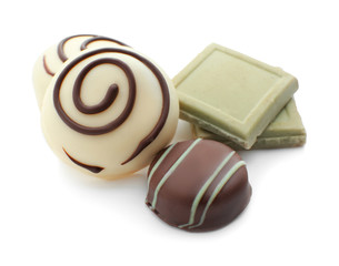 Tasty chocolate candies on white background