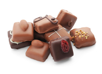 Tasty chocolate candies on white background