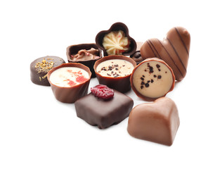 Tasty chocolate candies on white background