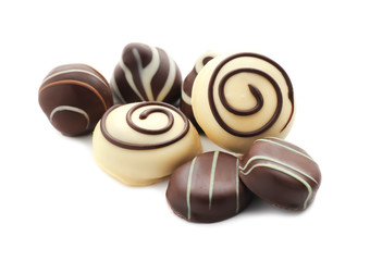 Tasty chocolate candies on white background